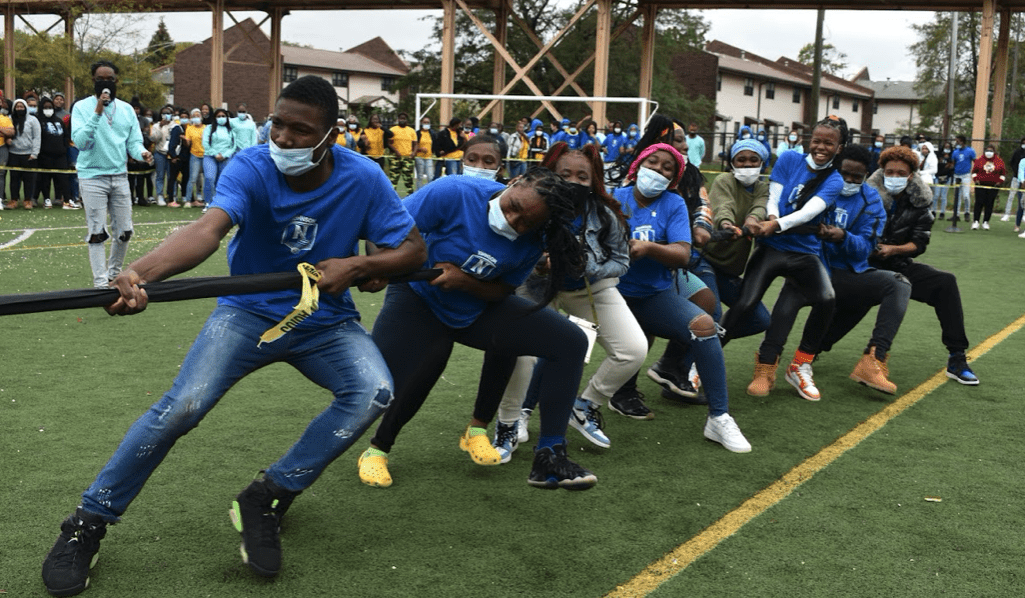Photo shows students competing in tug o' war at Johnson College Prep homecoming pep rally