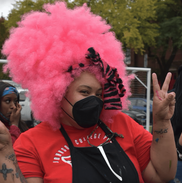 Photo shows Johnson College Prep student posing with Spirit Week costume