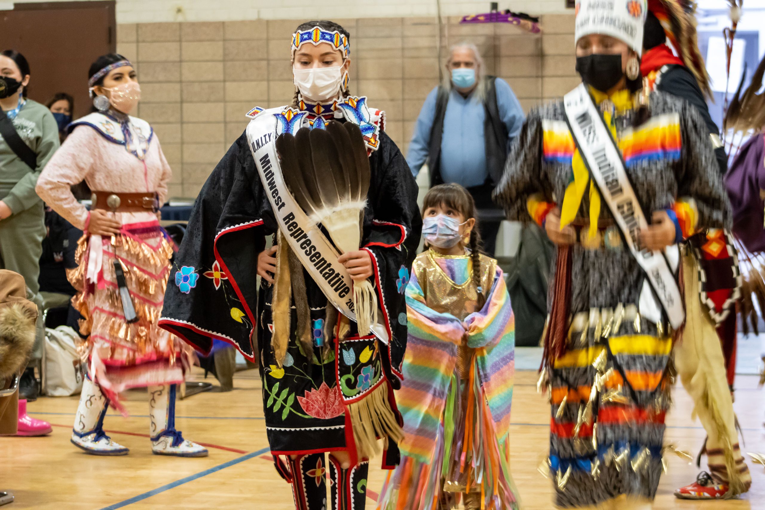 Photo shows Pritzker College Prep student Angelina Serna dancing in her regalia at a powwow at the American Indian Center
