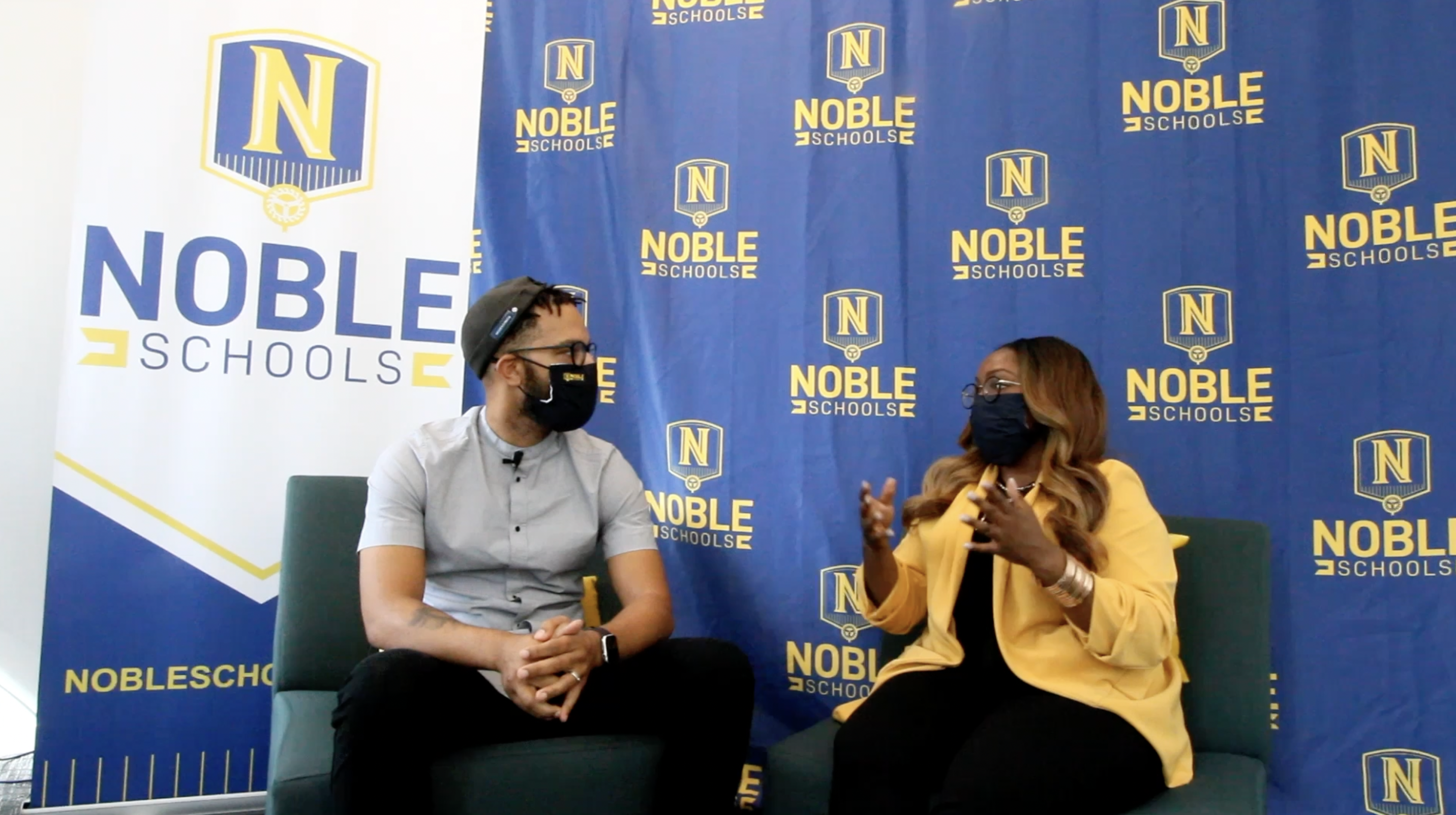 Photo shows Dr. Janine Franklin and Nicholas Jones, Student Culture and Support staff at Noble Schools, on the set of Changing the Course: Building An Antiracist Education video podcast