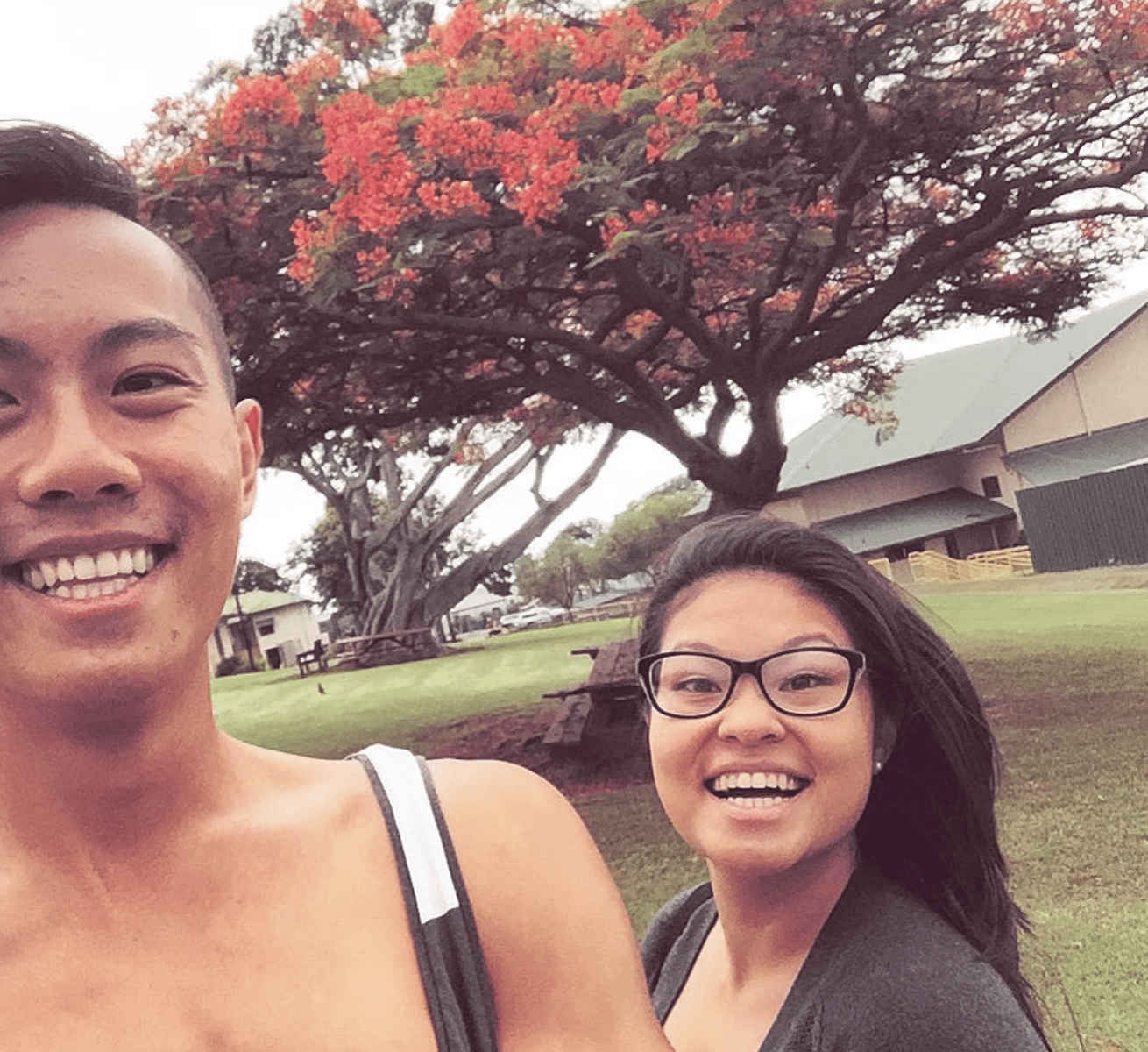 Photo says JY Sun on the left and their friend and colleague Sandy Tran on the right, in front of the school campus where they taught in Pahala, Hawai’i