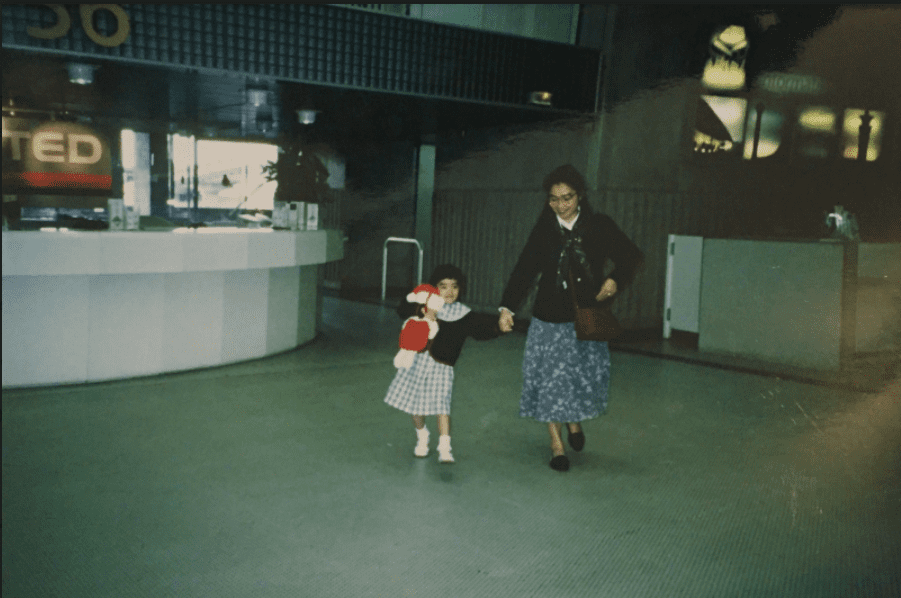 Photo shows Laura Houcque at 3 years old, arriving with her mom for the first time in the United States from France, in Chicago's O'hare airport