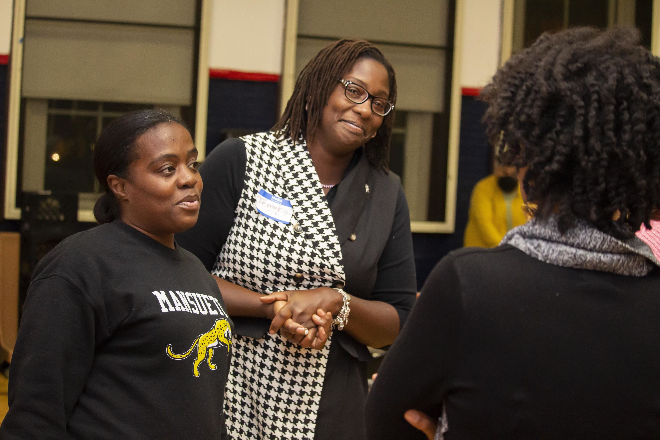 Photo shows two Noble Schools parents, Temeka Cartwright and Myisha Shields, talking with other parents and staff organizers at this year's first Parent Leadership Series meeting for all Noble schools in Chicago,IL.