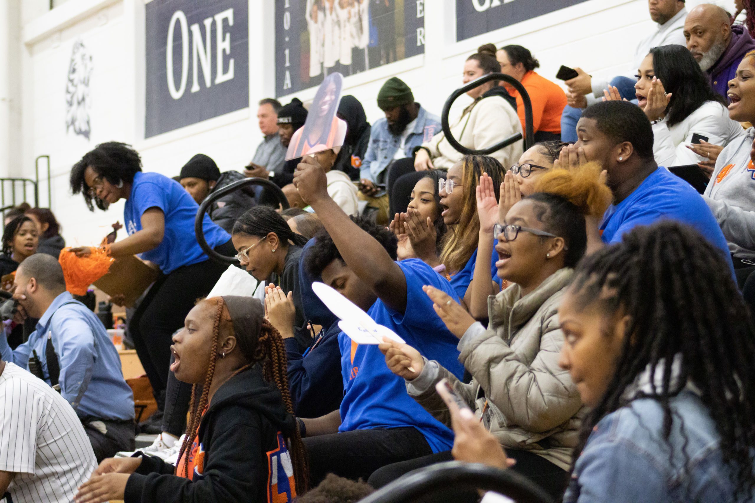 A crowd of students, staff, and families cheers for the Butler College Prep Lady Lynx varsity basketball team at the Illinois High School Association regional championship game in 2023.