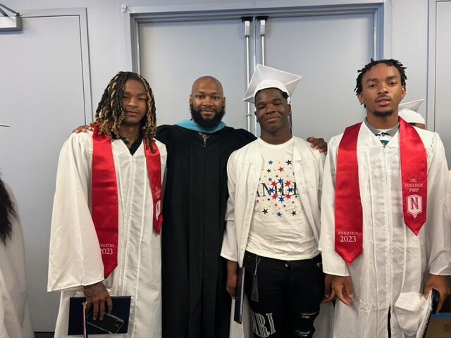 Burns at UICCP graduation with three graduates