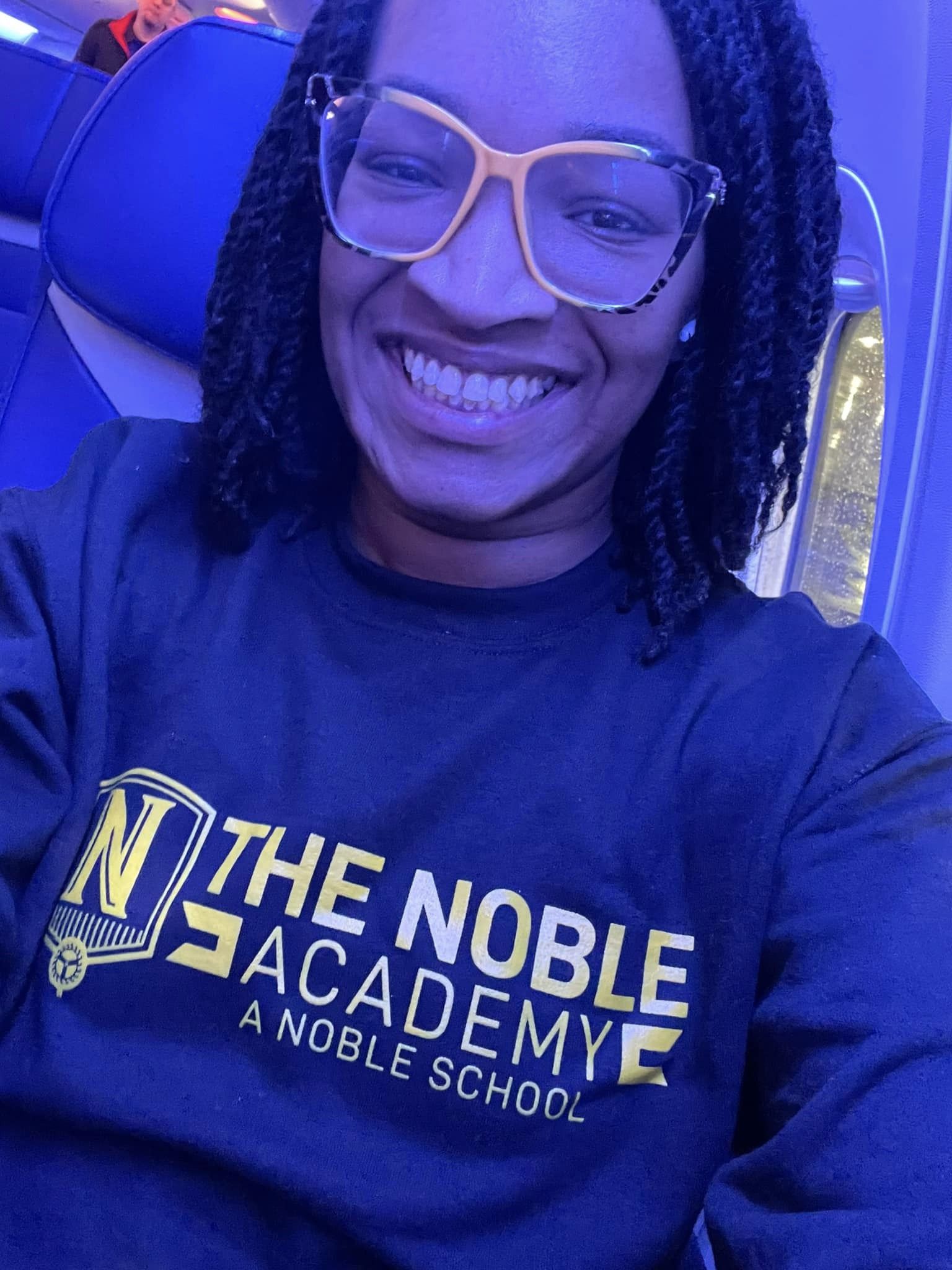 Pinkston smiling on a plane