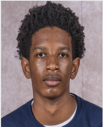 This photo is a headshot of Jermaine S, a senior at Rowe-Clark Math & Science Academy. He is a young Black man with short black hair and is wearing a dark blue sweatshirt.