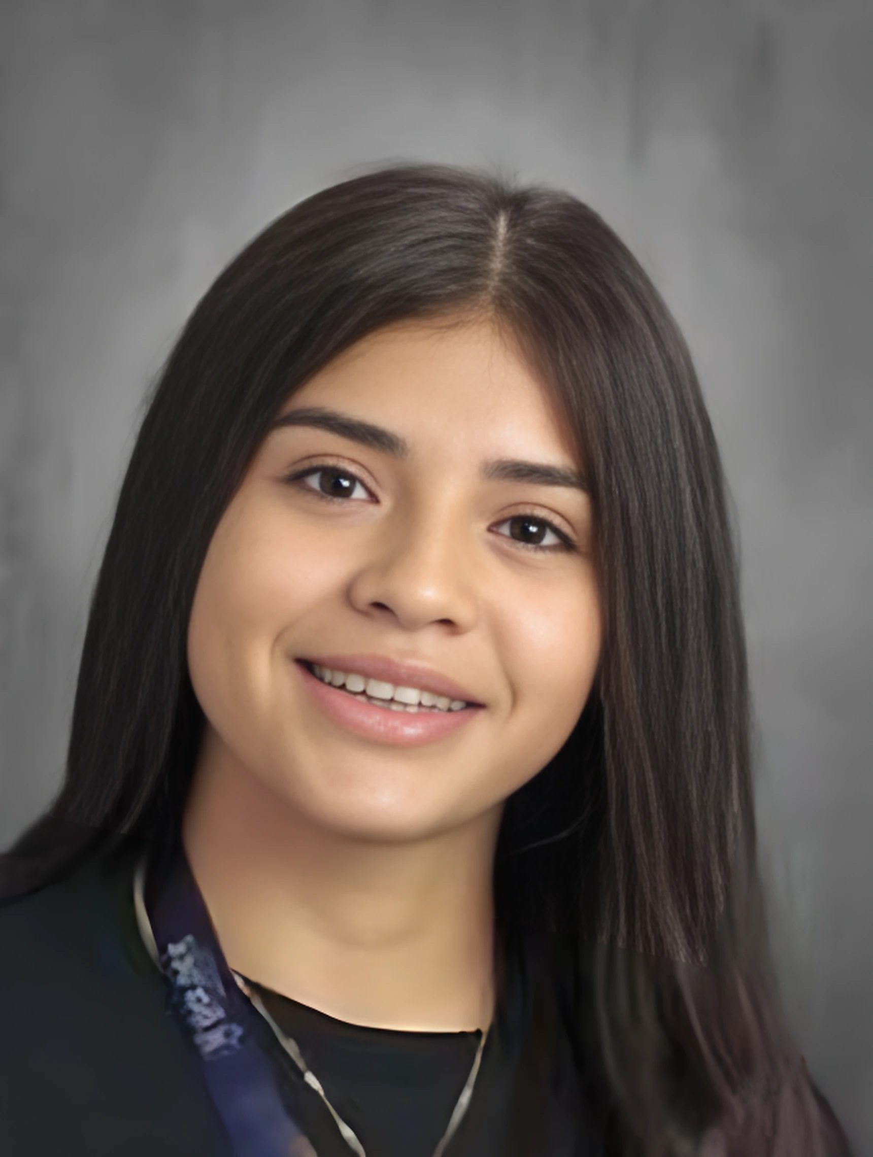 This photo is a headshot of Dayanara Gutierrez, a student at Golder College Prep. She is a young Latine woman with long straight hair. In this photo, she is smiling and wearing a black shirt.