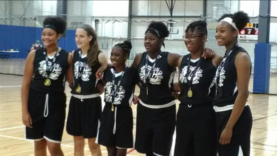 Photo shows Serenity with her Iowa-based team after they won their tournament when Serenity was in 7th grade.