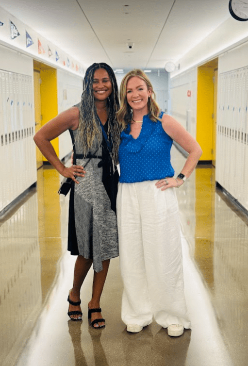 Lawrence with Noble CEO Constance Jones, standing in a Mansueto hallway.