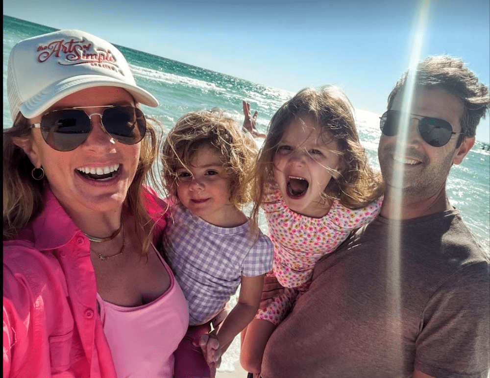 Lawrence on a beach with her family.