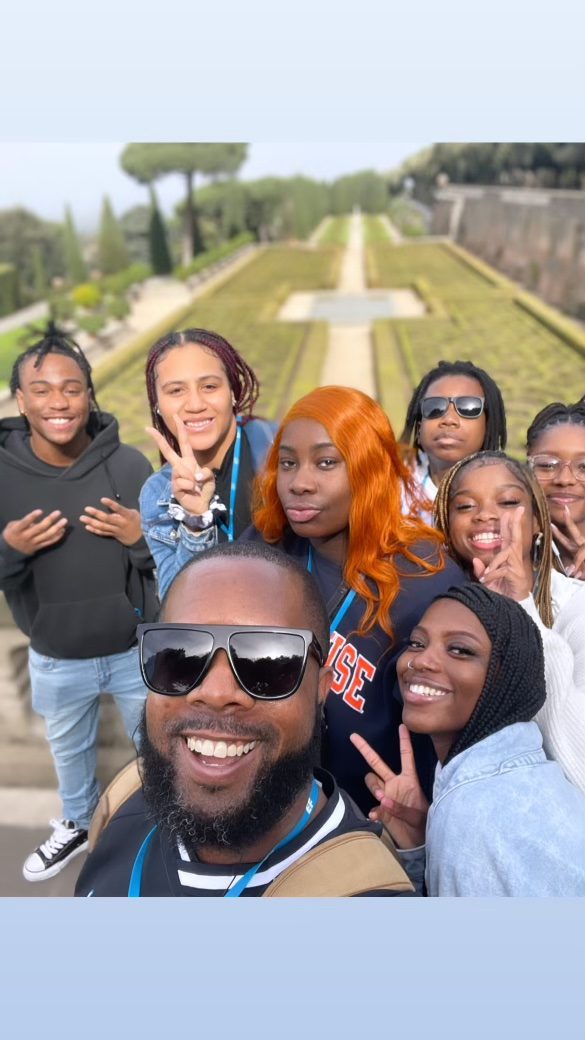 Riddick outside with students on a trip to Rome, Italy.