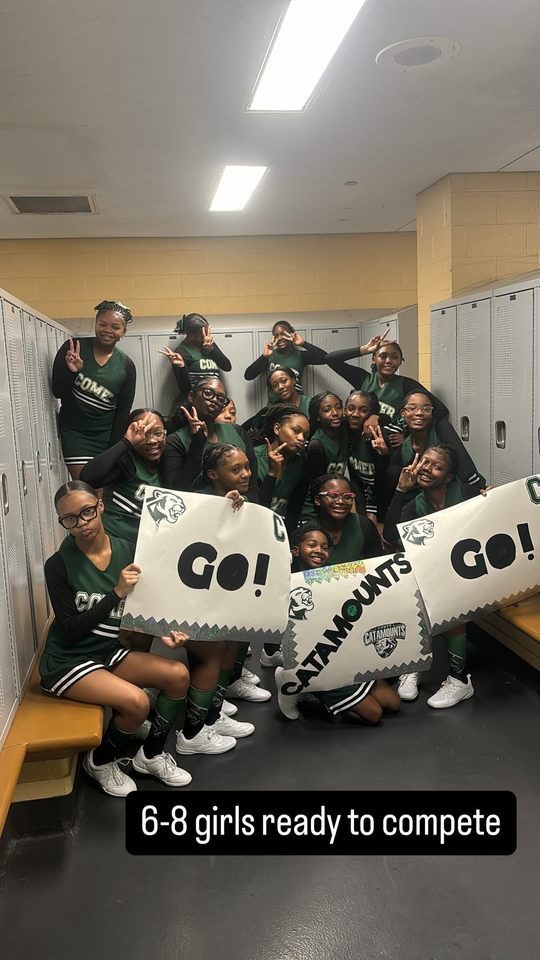 The middle school cheer team poses for a group photo in a locker room. They are wearing their green and white cheer uniforms and holding up signs that say "Go, Catamounts, Go!". There is a Instagram story caption at the bottom that says "Sixth through 8th grade girls ready to compete".