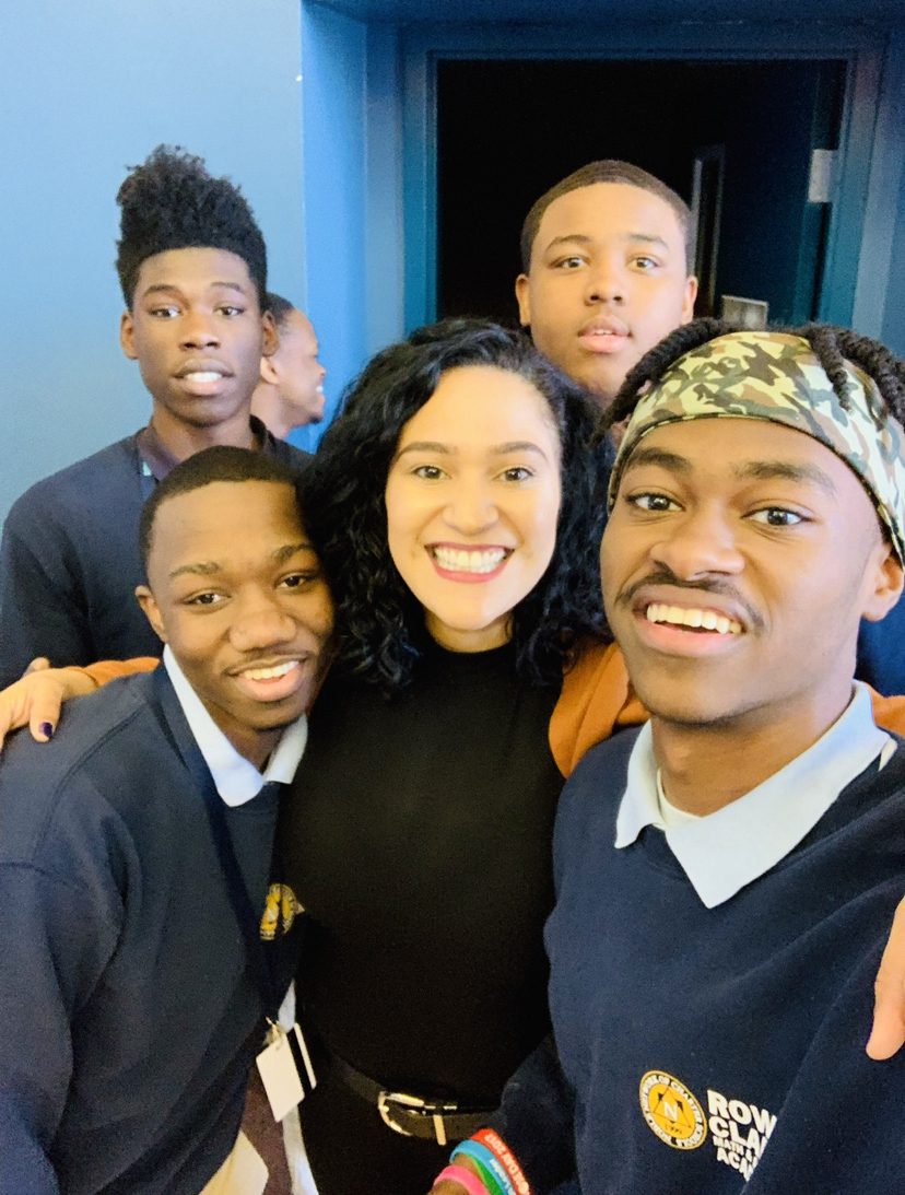 Brenda Cora taking a selfie with four Rowe-Clark students. Cora is in the center and they're all smiling.