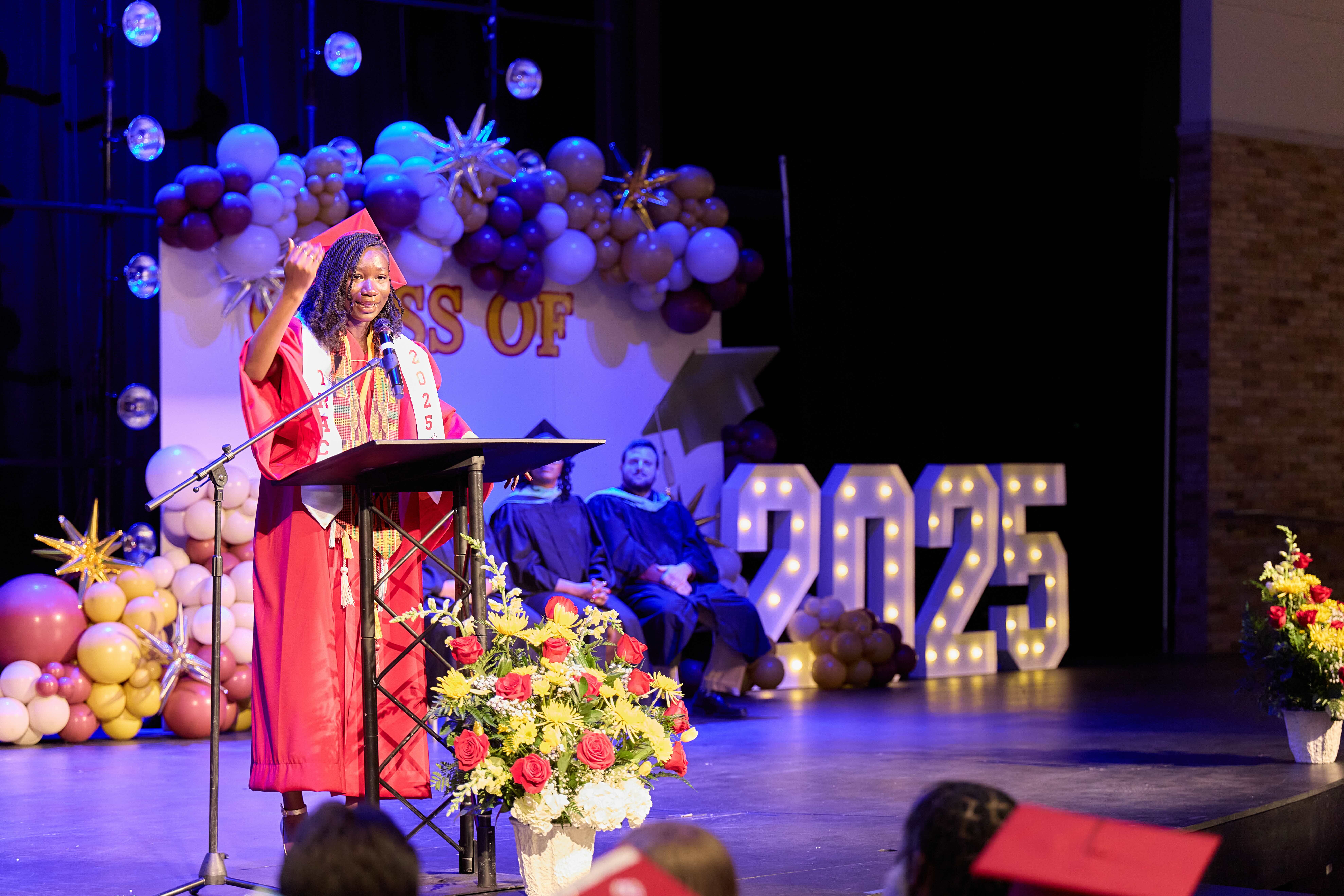 TNA's valedictorian gives her speech on the stage.