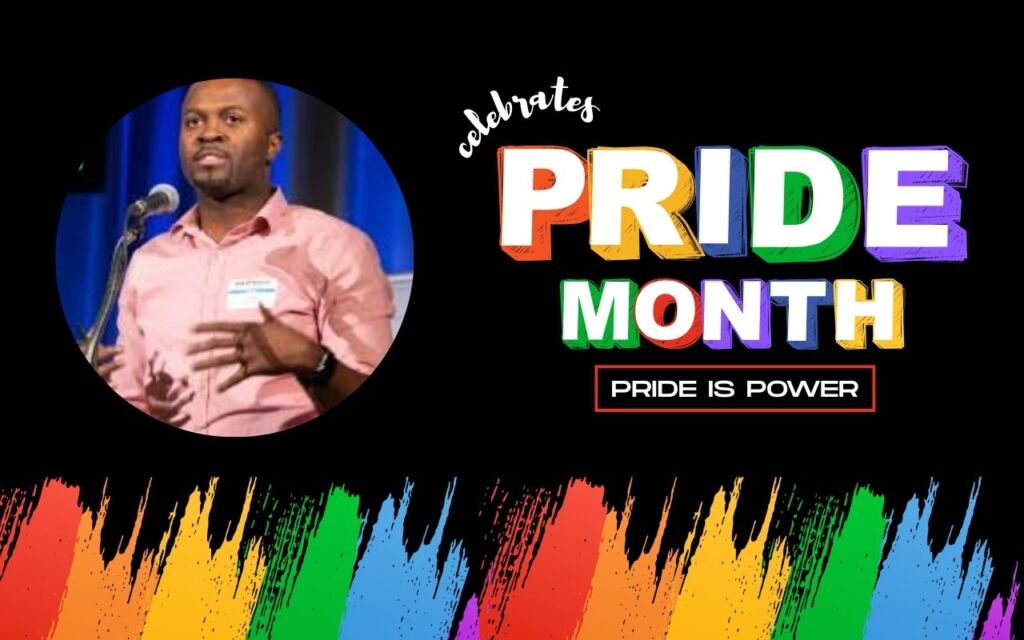 Cory Cain, dean of instruction at Pritzker College Prep, is pictured speaking at a panel in a light pink button up. This photo is on a black background with rainbow paint strokes at the bottom. To the right of his photo are the words "Celebrates Pride Month: Pride is Power".