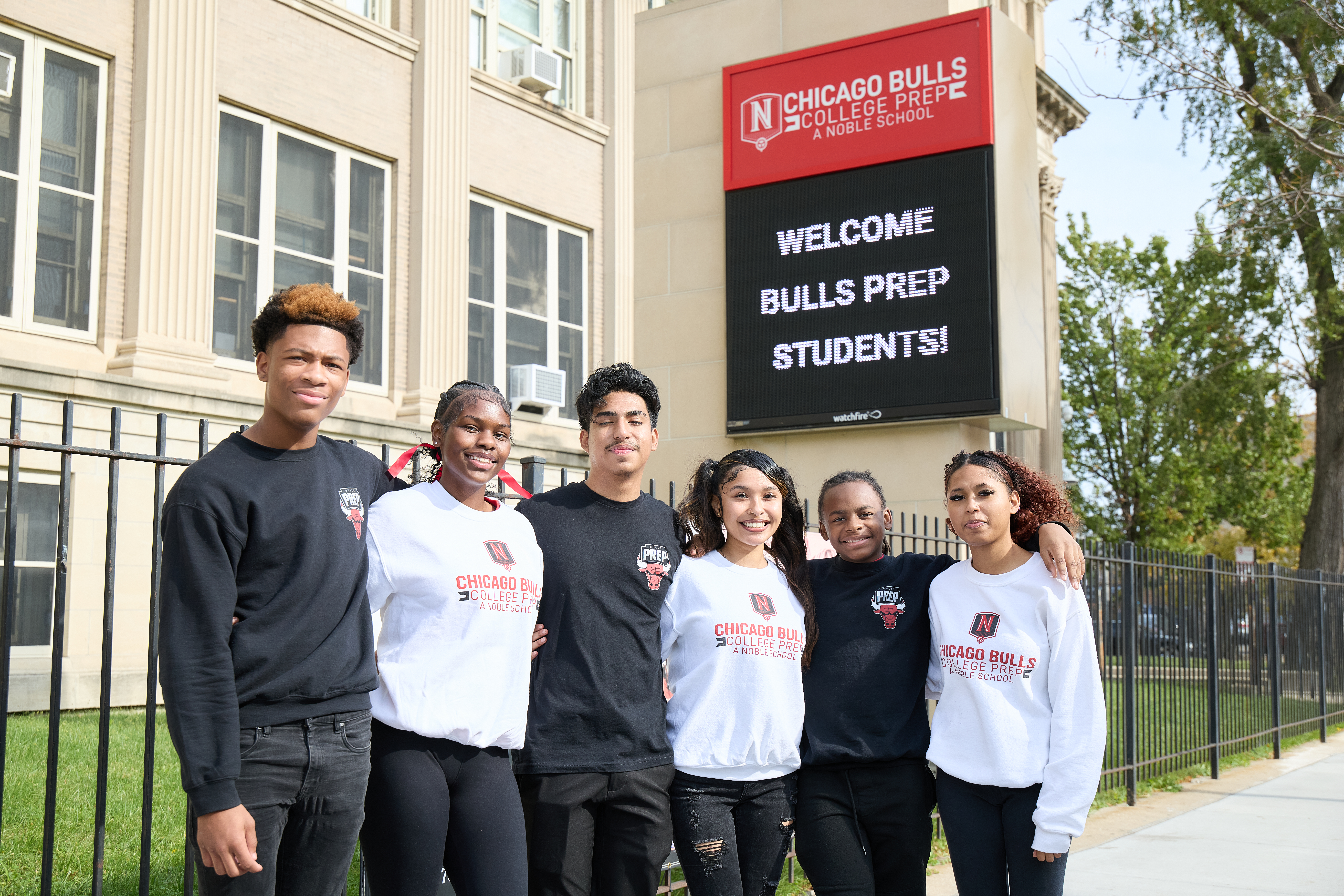 _LM_1720 Students standing by the Chicago Bulls College Prep welcome sign