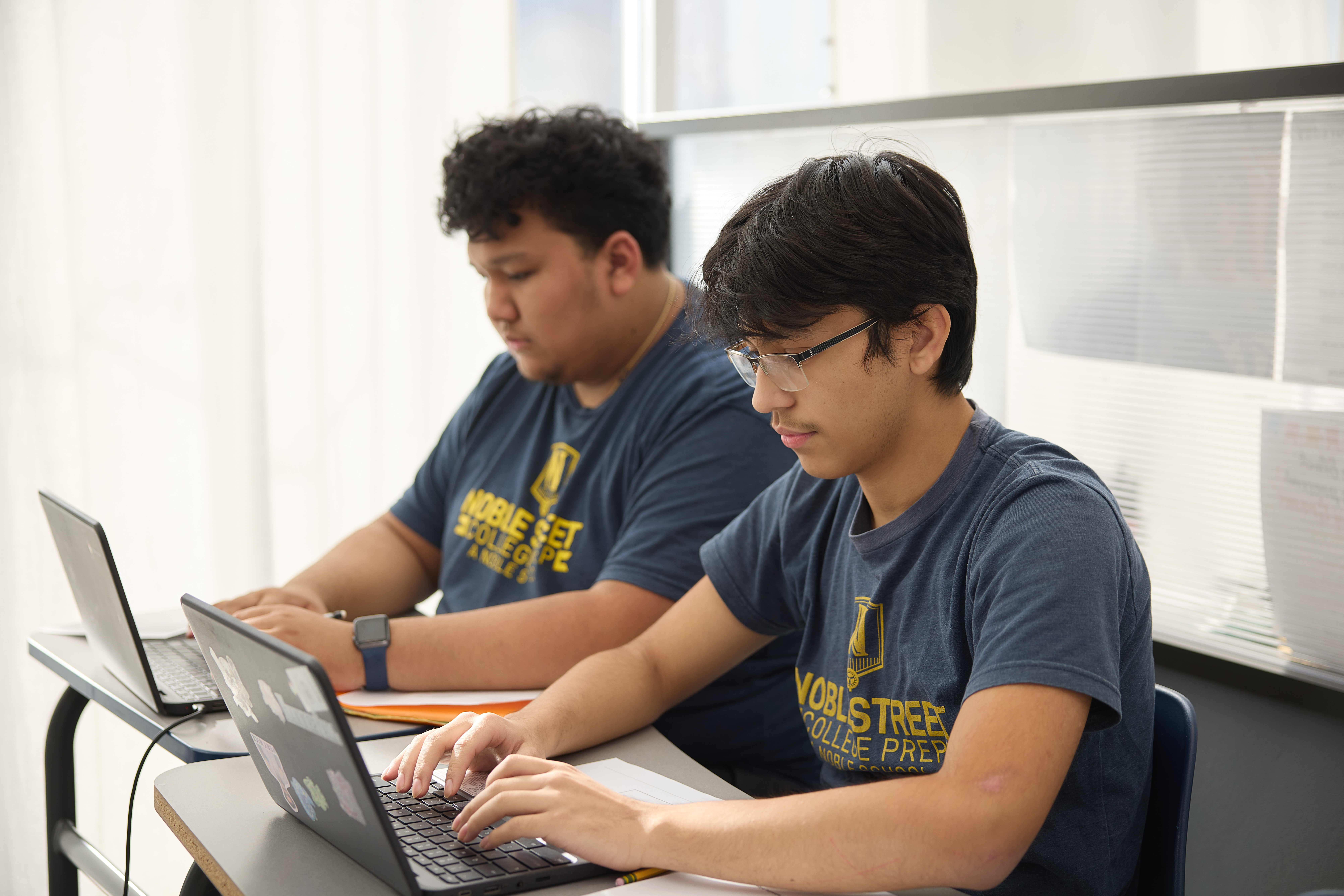 Students using a computer at Noble Street College Prep High School in Chicago