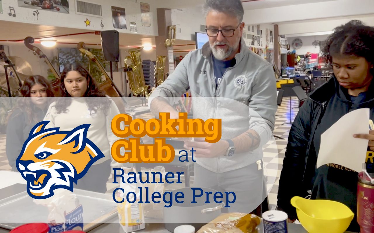 Robert Vega in Cooking Club is discussing a recipe with students at Rauner College Prep.