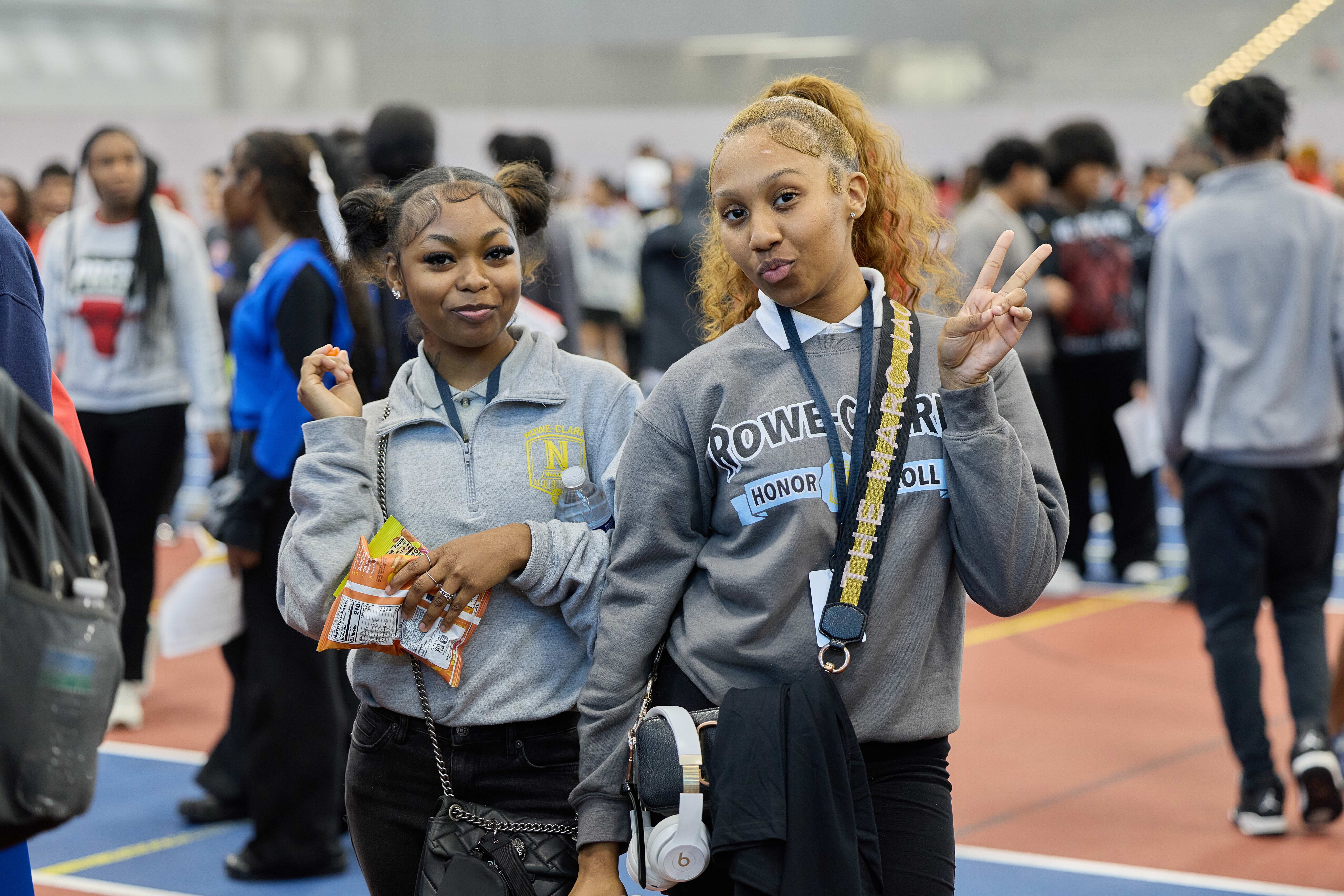 Two Rowe-Clark alumni posing for a photo at the HBCU College Fair