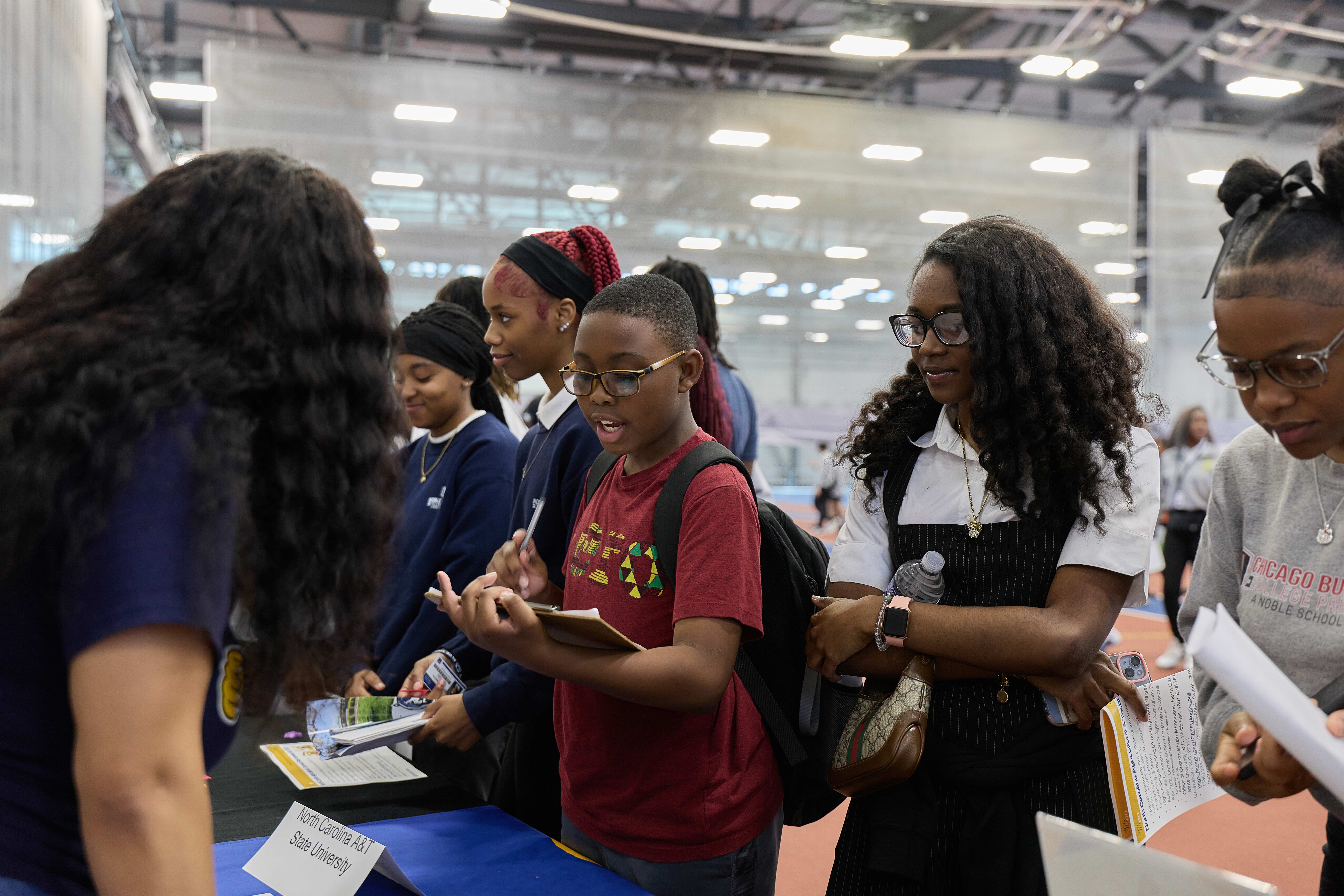 Group of students meeting a college representative at HBCU College Fair