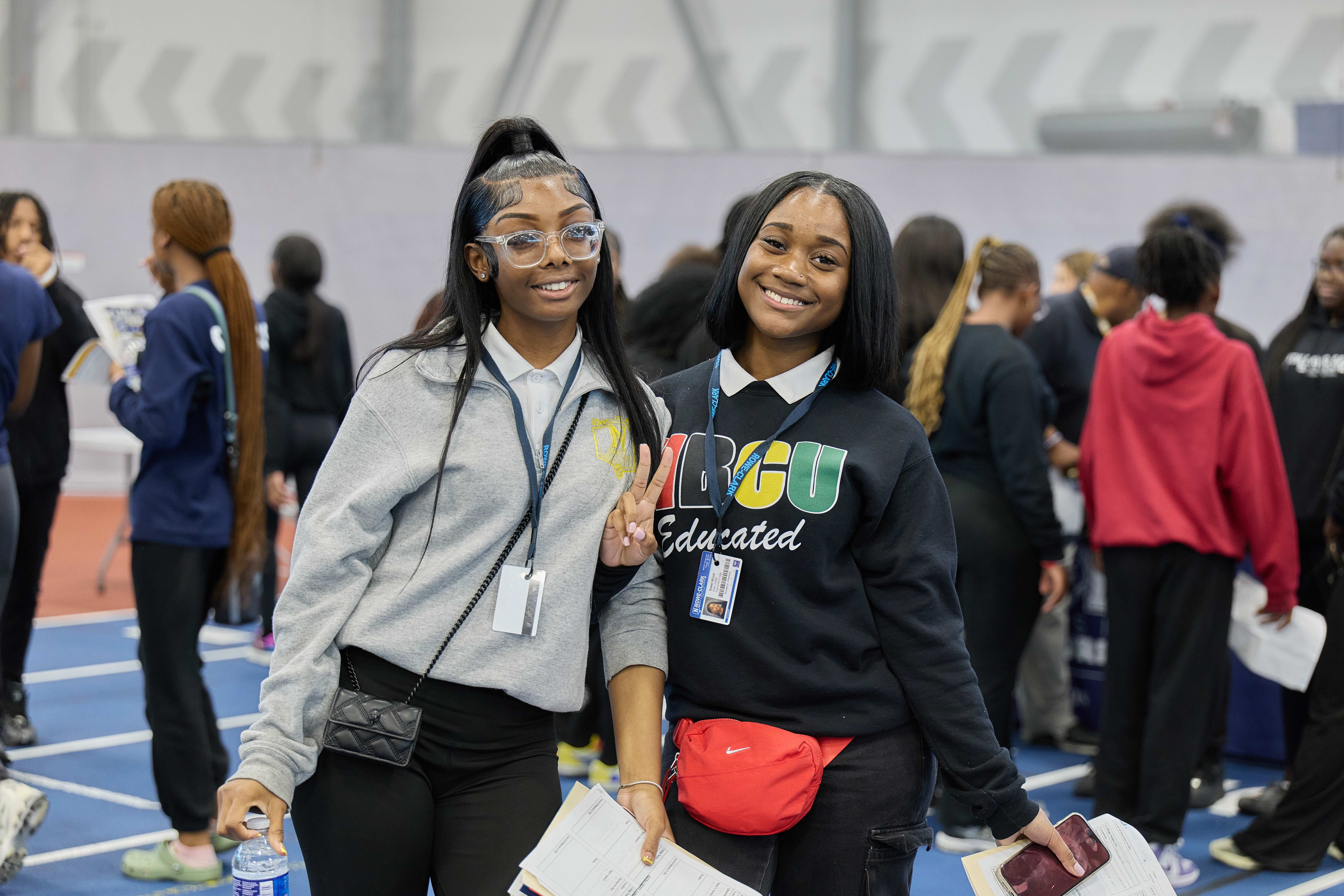 Two students posing for a photo at the HBCU college fair.