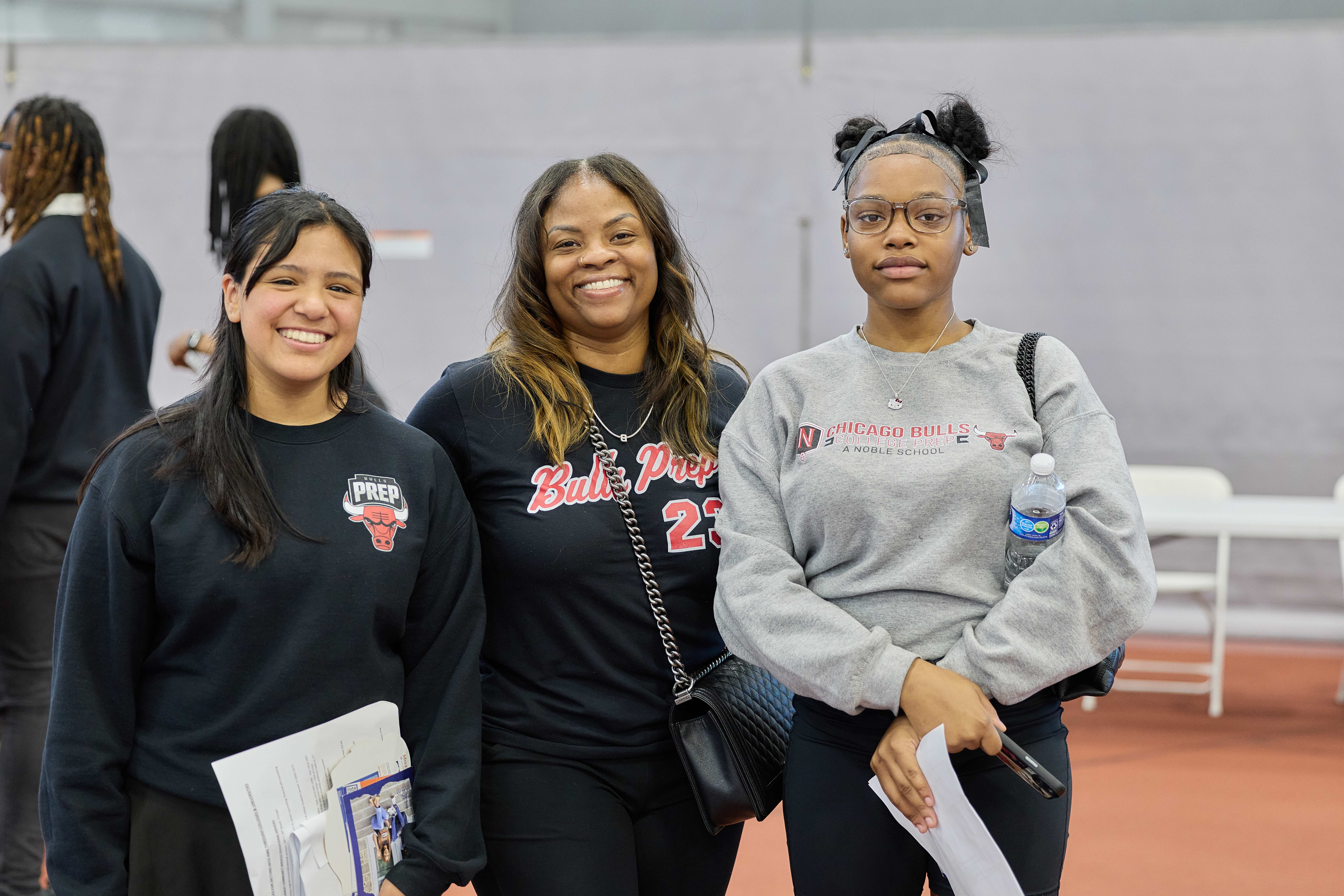 Three Bulls College Prep students at HBCU College fair posing for a photo.
