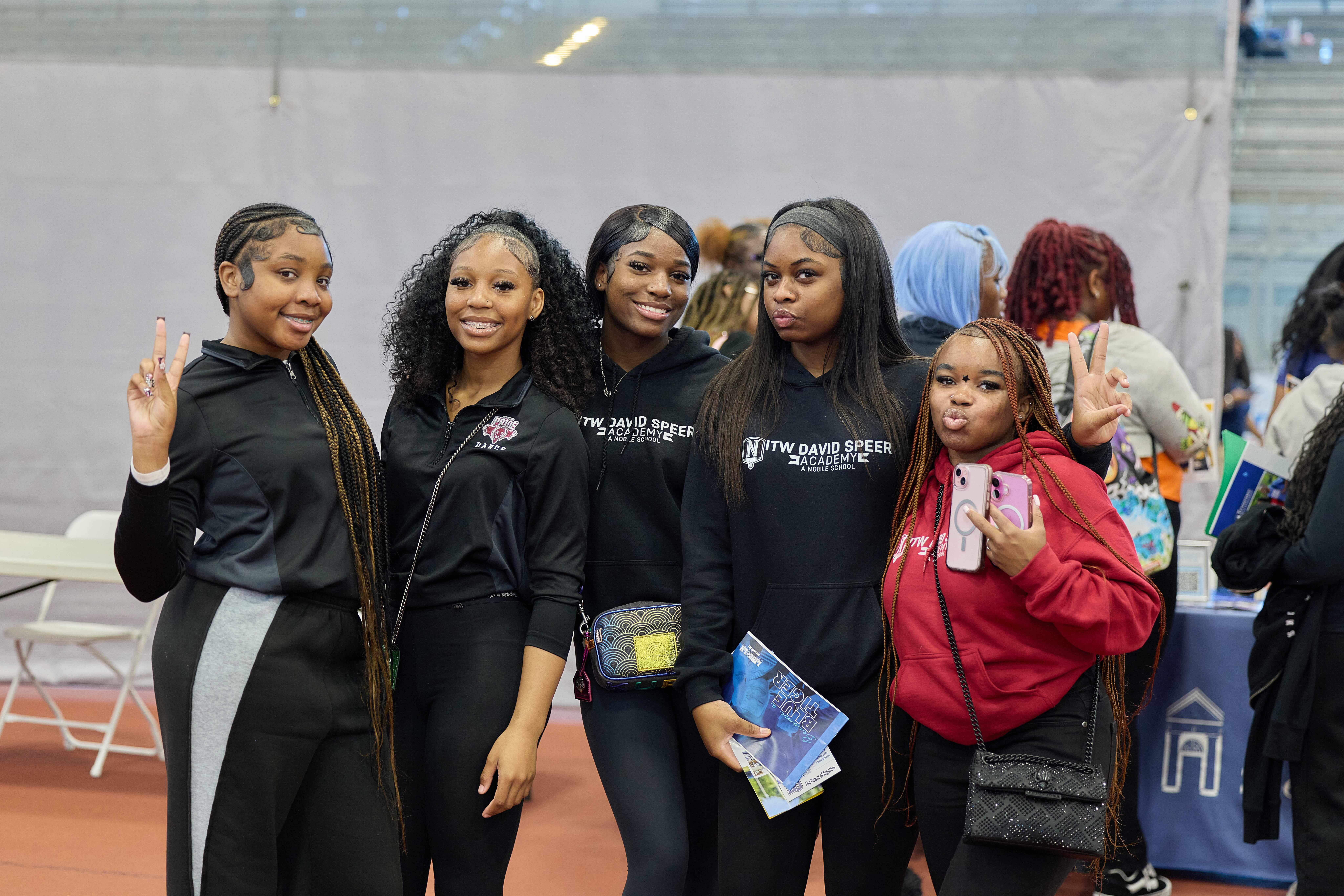 Five ITW David Speer students at HBCU College fair posing for a photo.