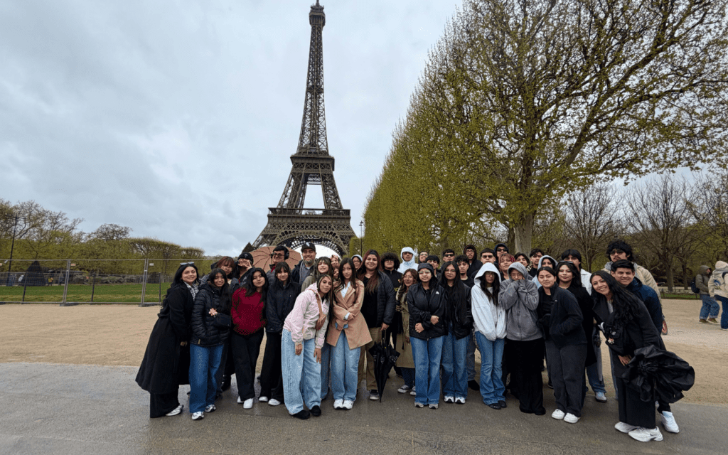 Mansueto High School students and staff pose for a group photo in front of the Eiffel Tower in Paris.