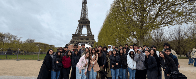 Mansueto High School students and staff pose for a group photo in front of the Eiffel Tower in Paris.