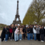 Mansueto High School students and staff pose for a group photo in front of the Eiffel Tower in Paris.